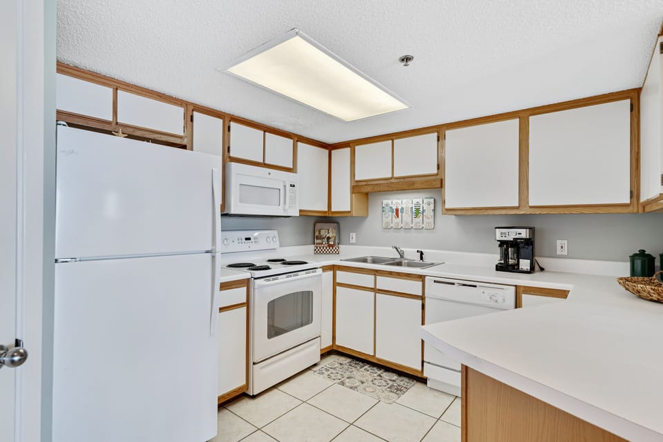 Full Size Kitchen with Stainless Steel Appliances and Breakfast Bar