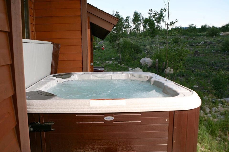 Enjoy the private outdoor hot tub all year round