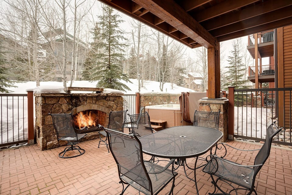 Gather around your private terrace with crackling fireplace and hot tub, perfect for warming up after mountain adventures.