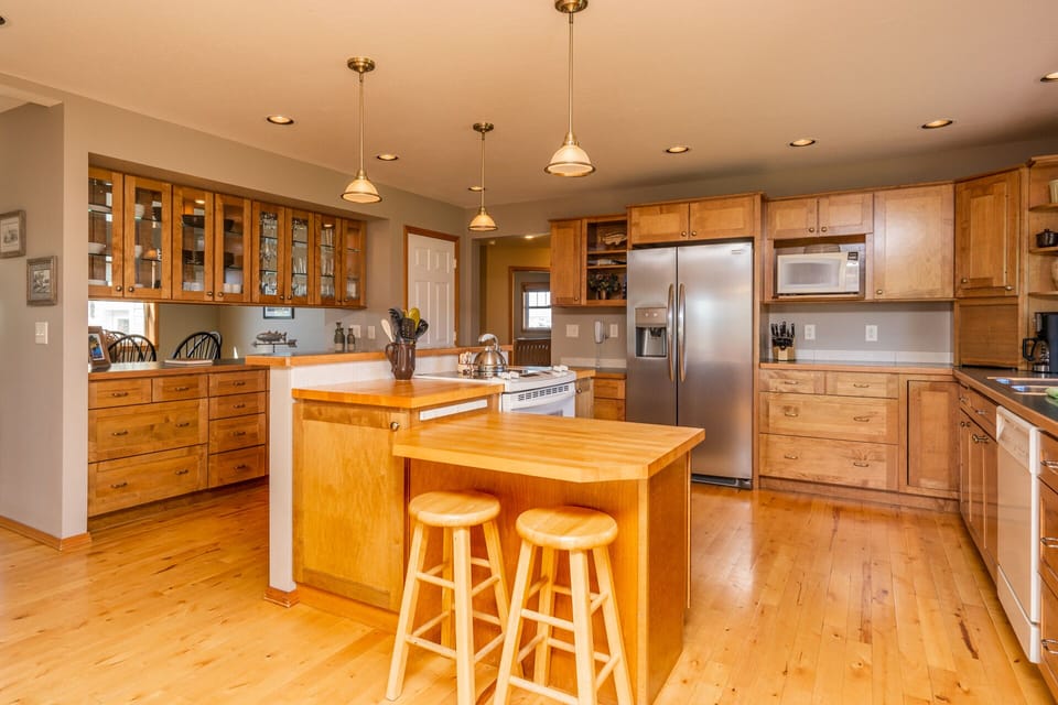 Kitchen island has five bar stools