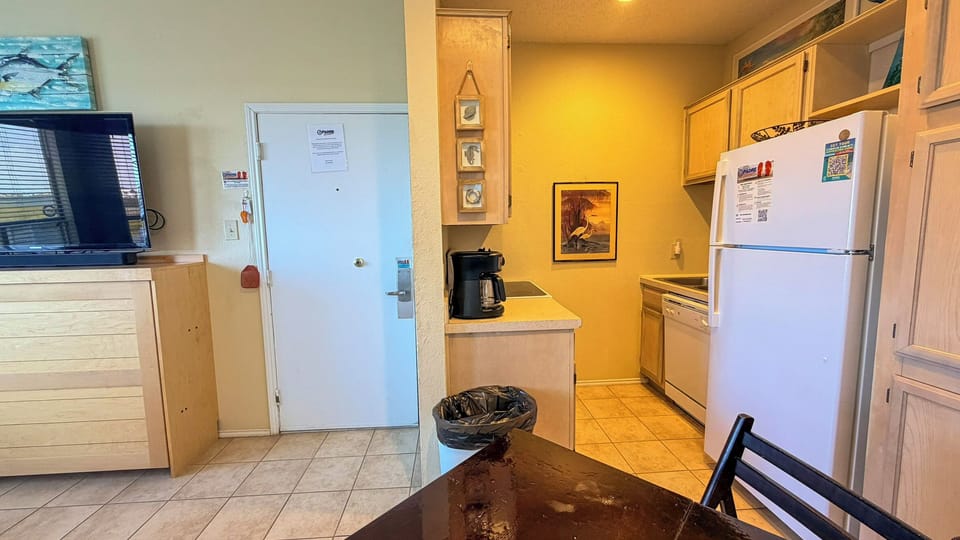 Your fully equipped kitchen awaits with everything needed for home-cooked meals, from morning coffee to family dinners together.