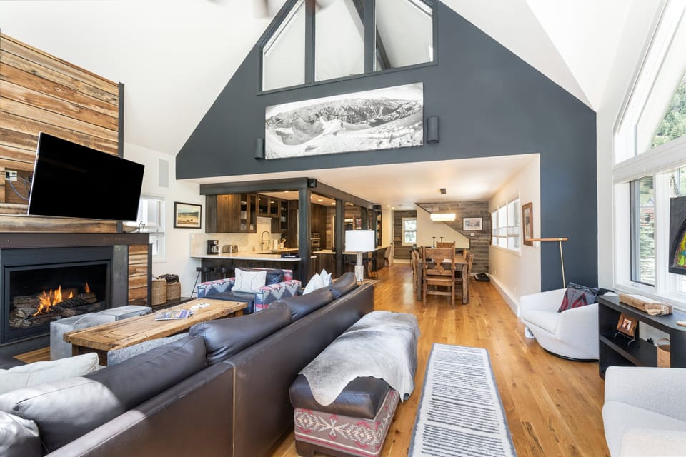 Plenty of lounging space in the living room to enjoy a movie or the cozy fireplace.
