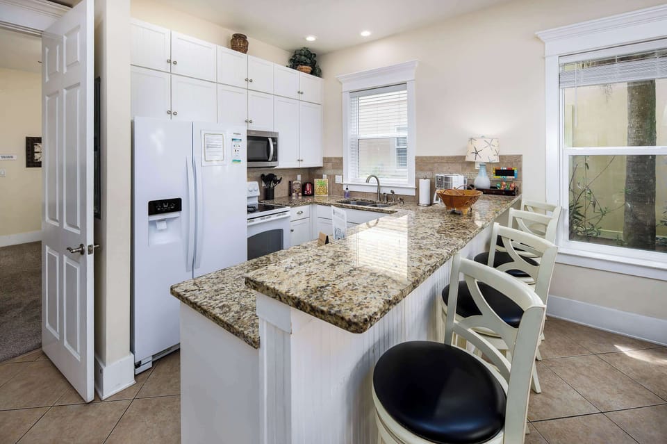 Fully stocked kitchen with breakfast bar