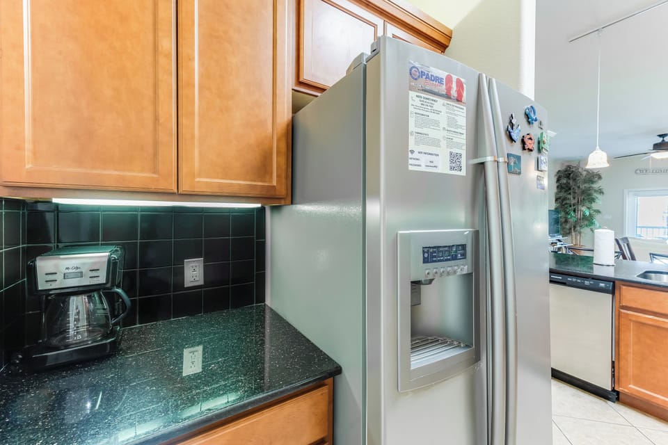 Your spacious kitchen features granite counters, stainless appliances, and everything needed to create memorable meals during your stay.