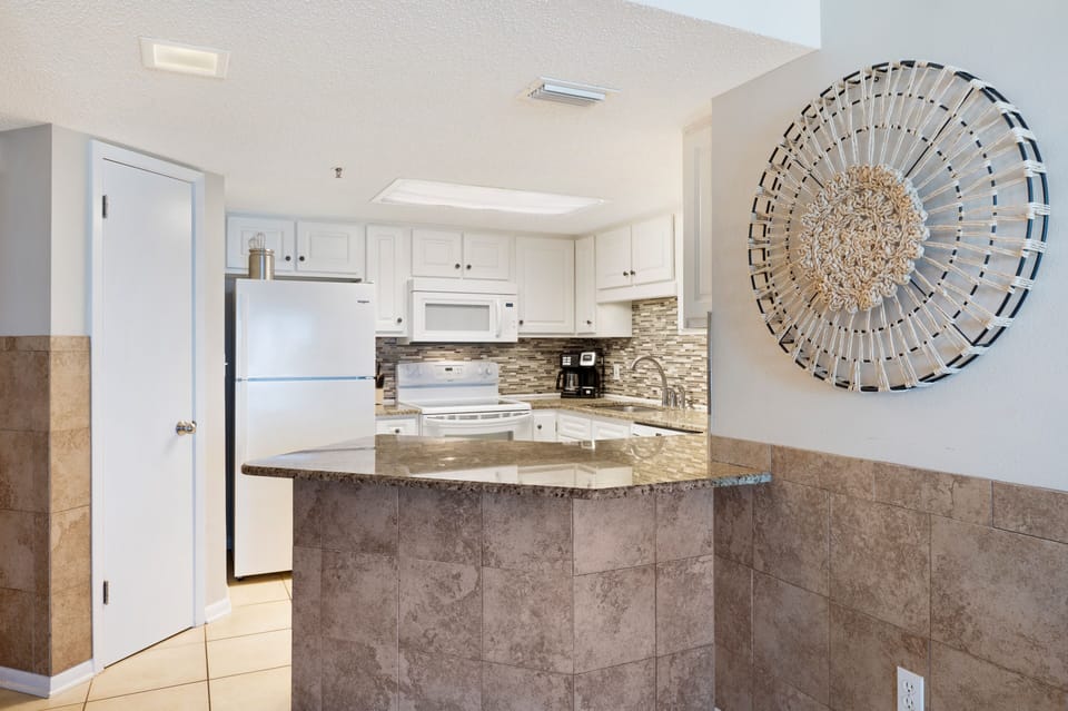 Full Size Kitchen has Upgraded Cabinets and Granite Counter Tops with a Breakfast Bar