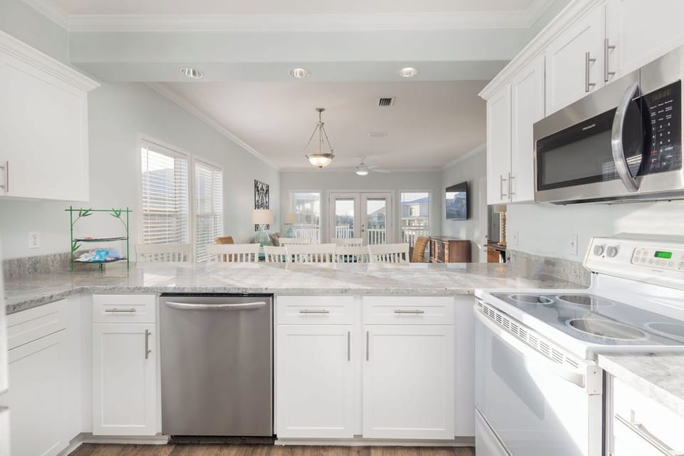 Kitchen - The large kitchen is fully stocked with both small and large appliances and offers all items needed for preparing your meals.