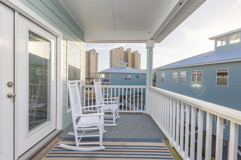 Balcony - The spacious balcony features plenty of seating including rocking chairs to make the porch sitting most enjoyable.