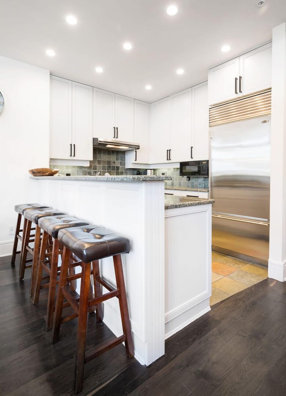 Beautiful kitchen with modern appliances and a spacious breakfast bar