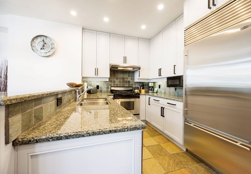 High-end appliances and granite counters for a perfect cooking experience