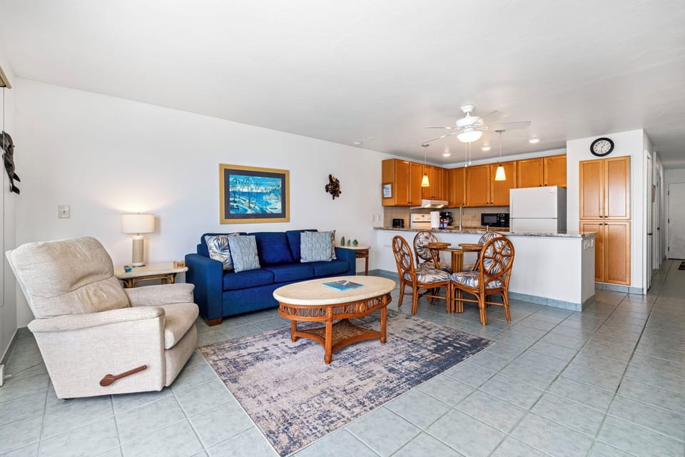Living room features a sofa sleeper for additional guests and its own ceiling fan