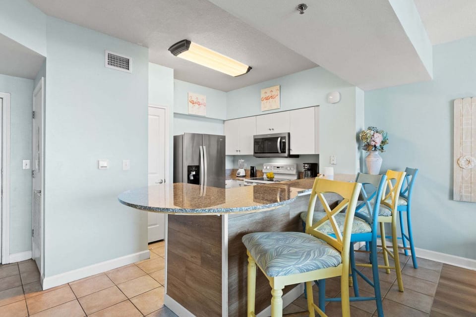 Fully Stocked Kitchen with Bar Seating