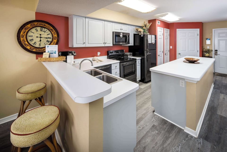 Fully stocked kitchen with breakfast bar