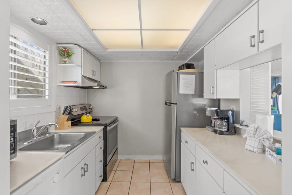 Your fully equipped galley kitchen features modern appliances, ample counter space, and everything you need to prepare meals during your stay.