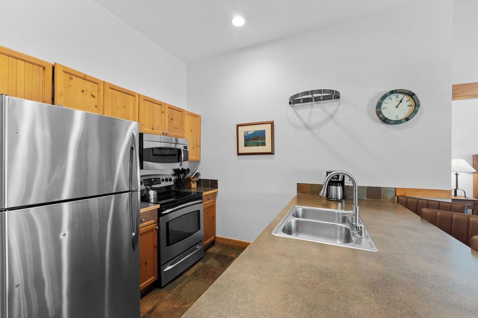 Your fully equipped kitchen features stainless steel appliances and spacious countertops, perfect for preparing meals during your stay.