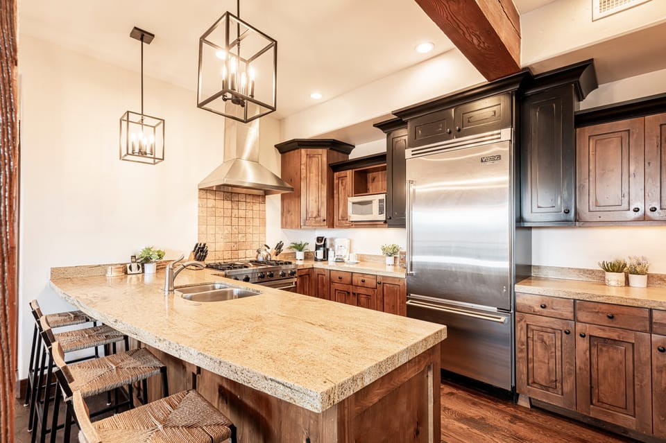 Chef's kitchen with stone counters and Viking appliances