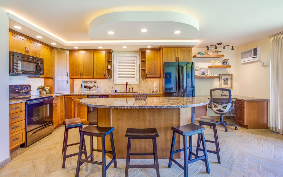 Custom kitchen and center island - Amazing transformation of the living space.  Oceanfront views while sitting at the island or prepping meals for the day