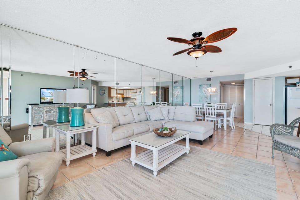 Spacious Living Area with plenty of Comfortable Seating and Balcony Access