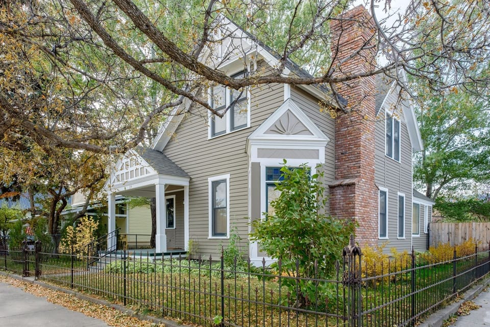 Restored Victorian style home with a fully fenced yard.