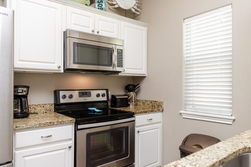 Your fully equipped kitchen features granite countertops, stainless steel appliances, and everything you need to prepare memorable meals during your stay.