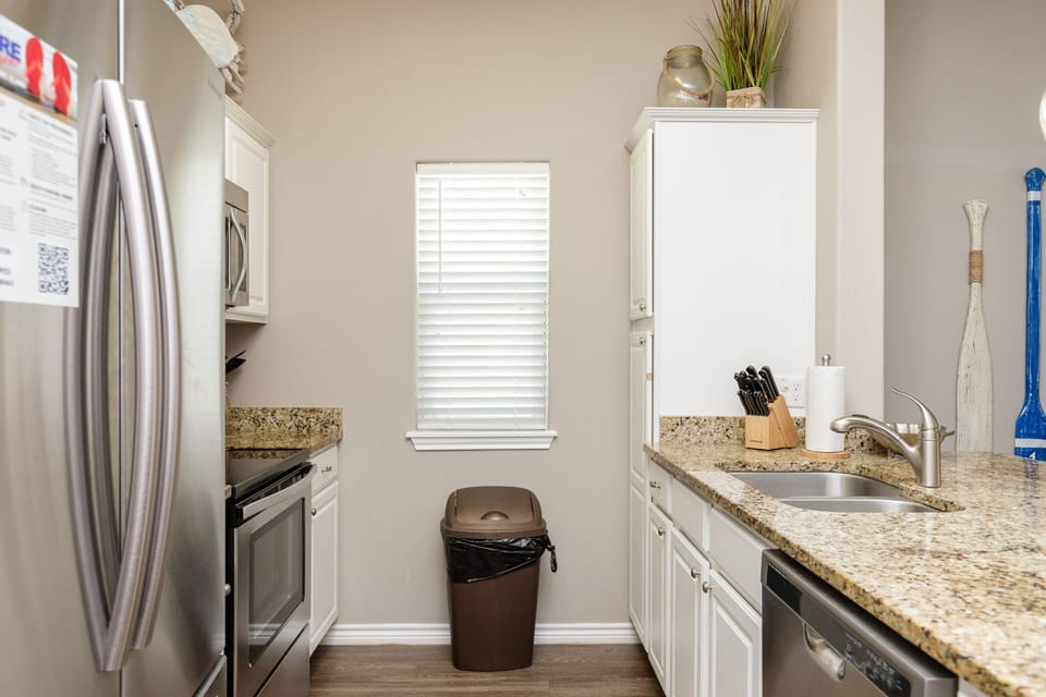 Your fully equipped kitchen awaits with granite countertops, stainless steel appliances, and everything you need to create memorable meals during your stay.