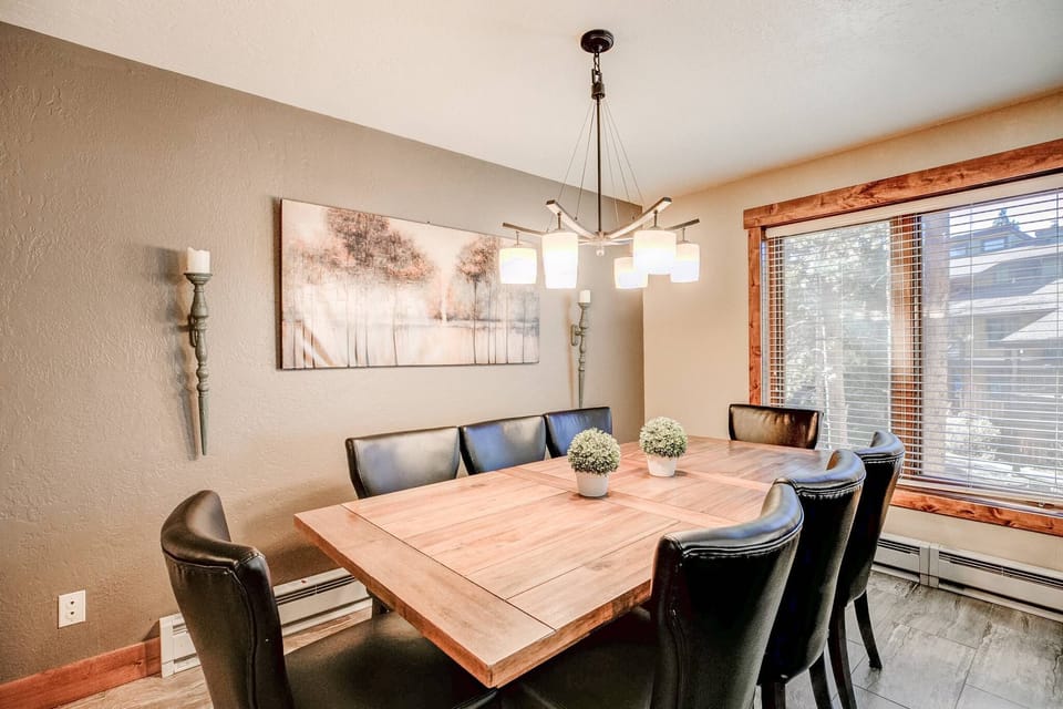 The 8-person dining table offers ample space to gather for meals with your group.