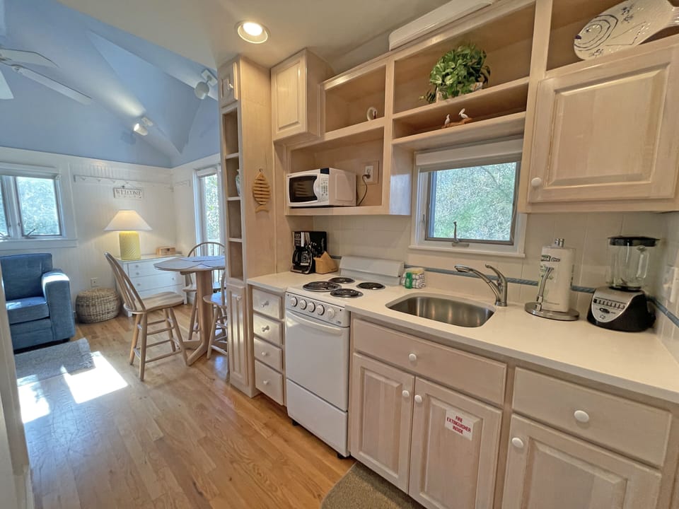 KITCHEN ADJACENT TO LIVING AND DINING AREA