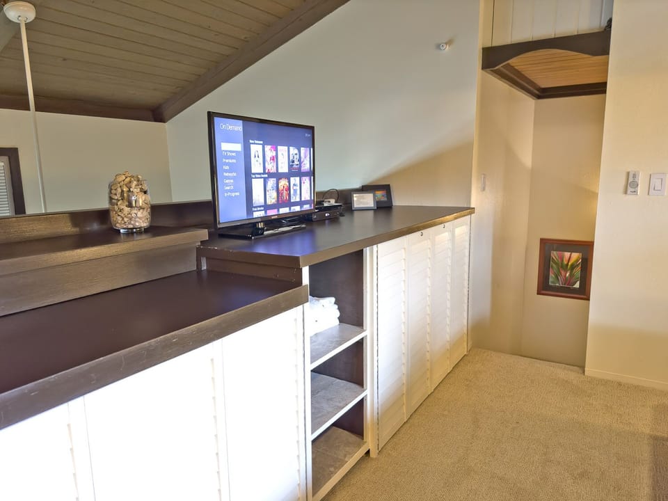 Upper level Master loft with plenty of storage for all your personal items, as well as a flat screen TV.