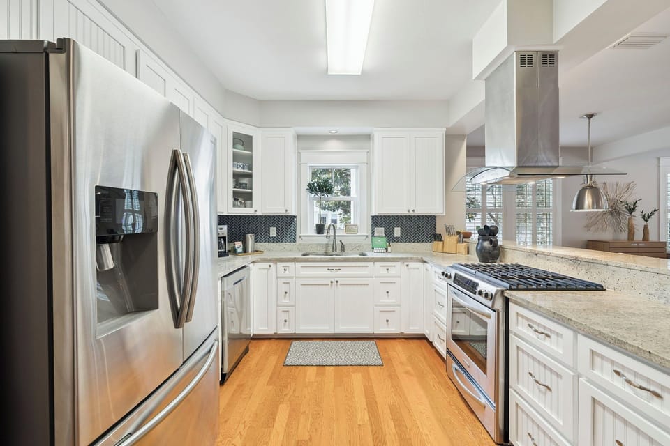 Cook your favorite meals in this bright, fully equipped kitchen with granite counters, stainless appliances, and all the space you need.