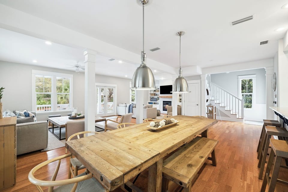 Gather around this beautiful farmhouse table where your group can share meals and make memories in this bright, open living space.