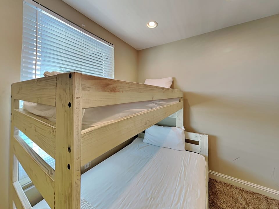 Fourth Bedroom - TV and Adjacent Full Bathroom in Hallway