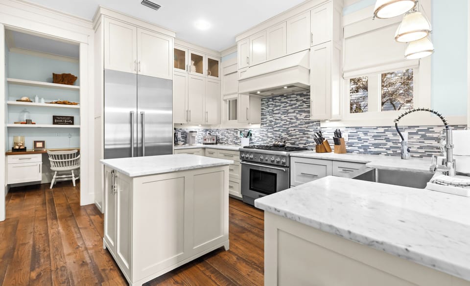 Your gourmet kitchen awaits with marble countertops, professional appliances, and a kitchen island.