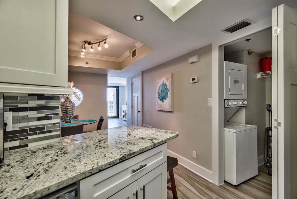 Laundry room with stacked washer dryer