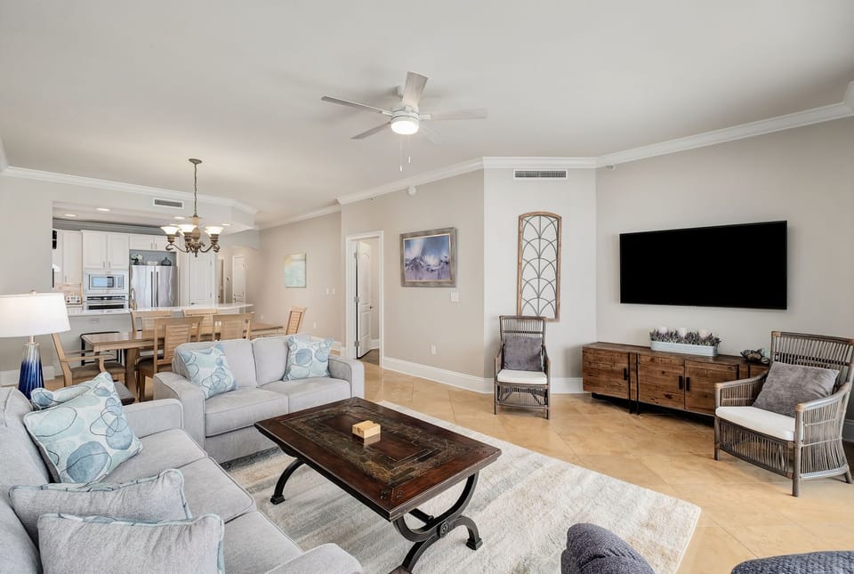 Unwind in your open-concept living space, designed for comfort and connection. Soft neutral tones, coastal accents, and modern amenities invite you to relax and feel right at home.