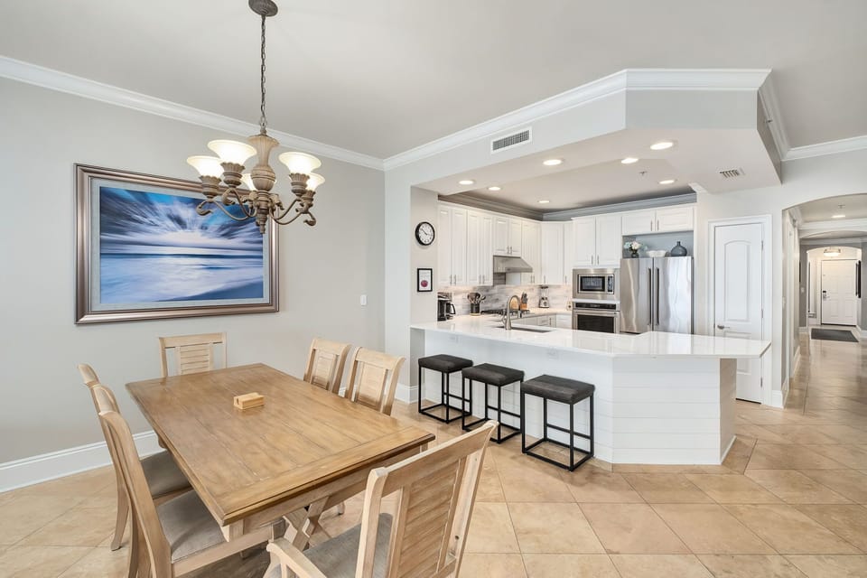 Your open-concept dining and kitchen area invites you to gather around the spacious table or relax at the breakfast bar, with modern appliances and elegant lighting making meal prep and dining feel effortless.