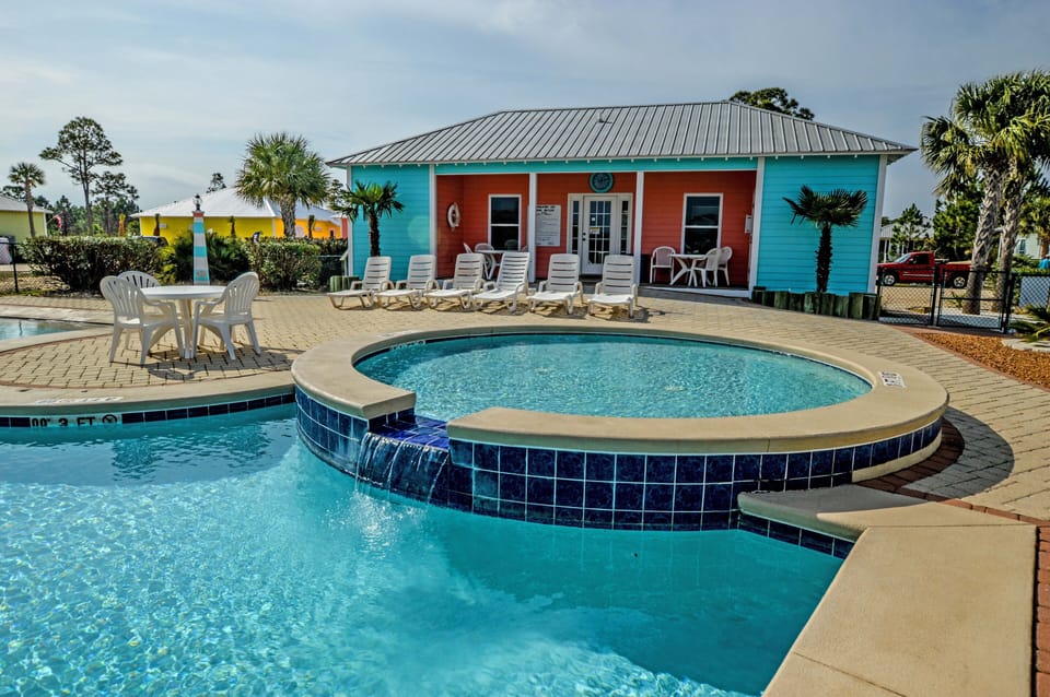 Main Pool - The main pool is zero entry and also has a kiddie pool. A clubhouse with restrooms is provided for convenience.