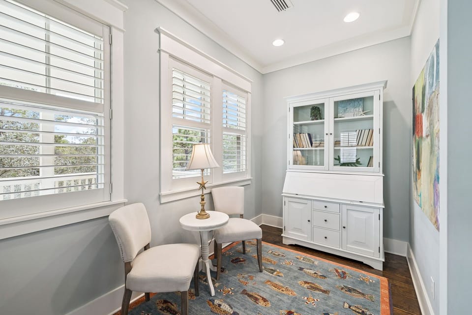 Sink into comfortable seating by your bright windows, surrounded by built-in storage and soft natural light.