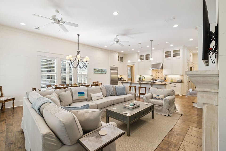 Unwind in this bright open-concept space where your plush sectional sofa faces a chef's kitchen, perfect for relaxing evenings.