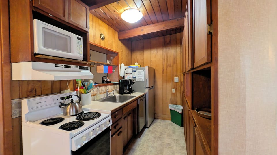 kitchen has apartment size dishwasher & refrigerator