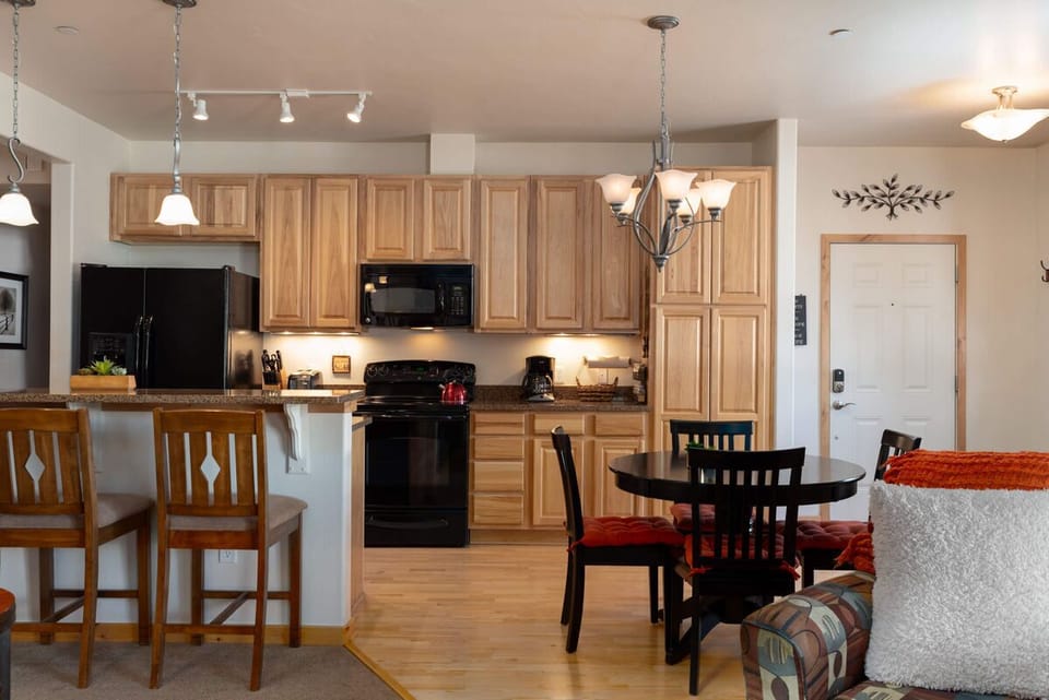 Connected kitchen and dining rooms unite guests