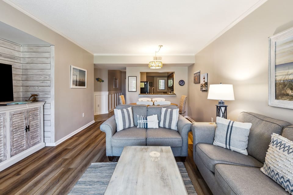 Living Room with Flat Screen TV and Private Balcony