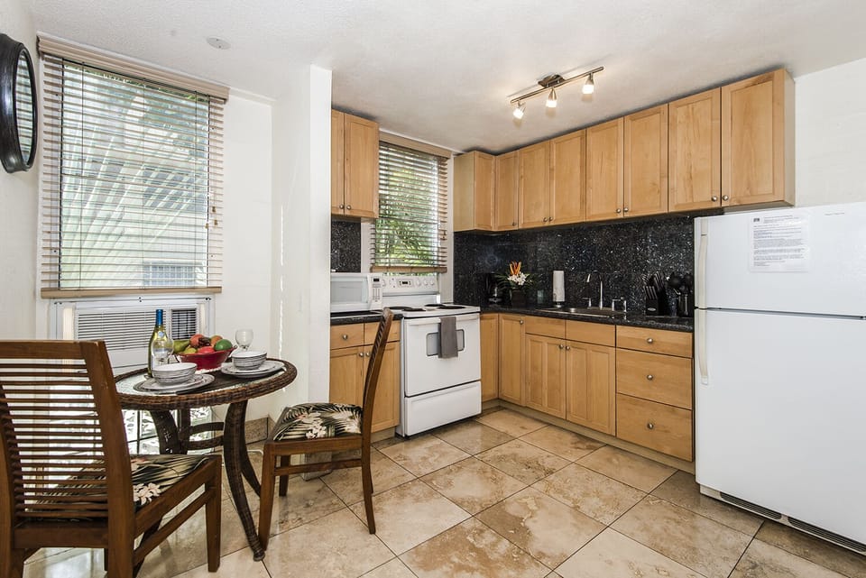 Immaculate Kitchen by Dining Area with Window AC