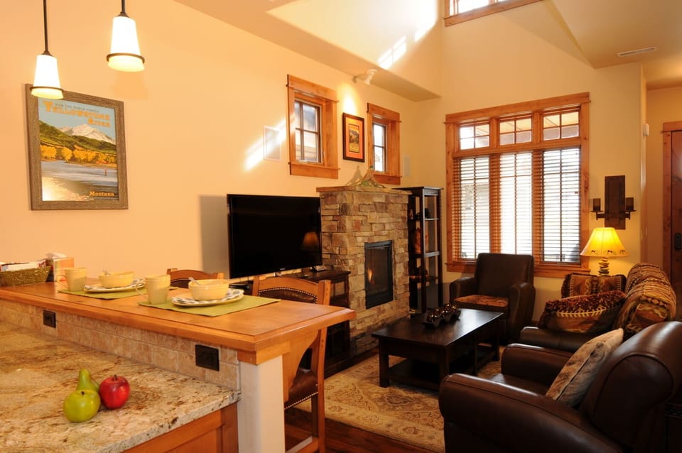 The living room is open to the dining area and kitchen.