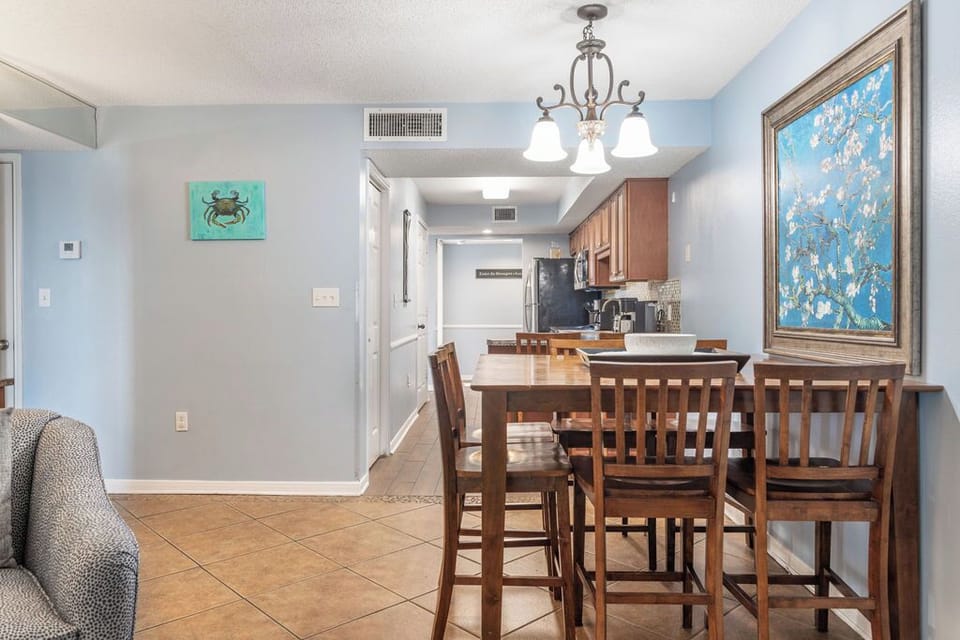 Dining Area - Welcoming open dining area showcasing a table that comfortably accommodates six, perfect for gatherings and memorable meals.