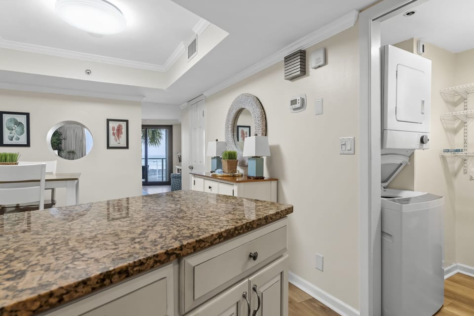 kitchen showing laundry room next to kitchen entrance