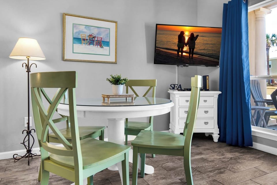 The dining table has seating for four