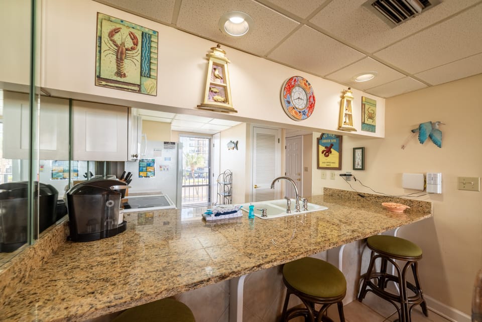 Well equipped kitchen with the latest appliances, including a Keurig machine, and granite counter tops for preparing mouth watering meals & snacks