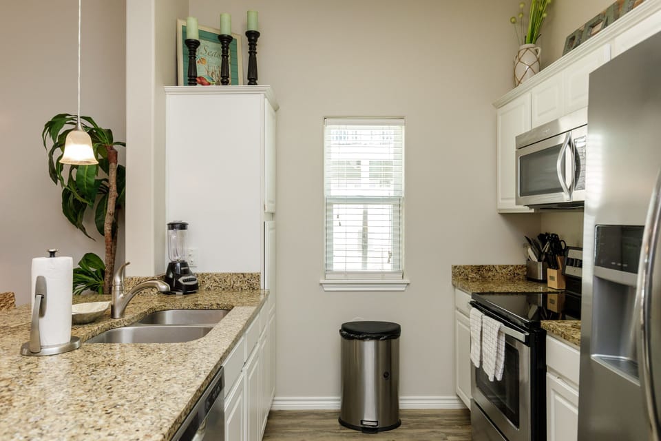 Your fully equipped galley kitchen features granite counters, stainless appliances, and everything you need to prepare meals during your stay.