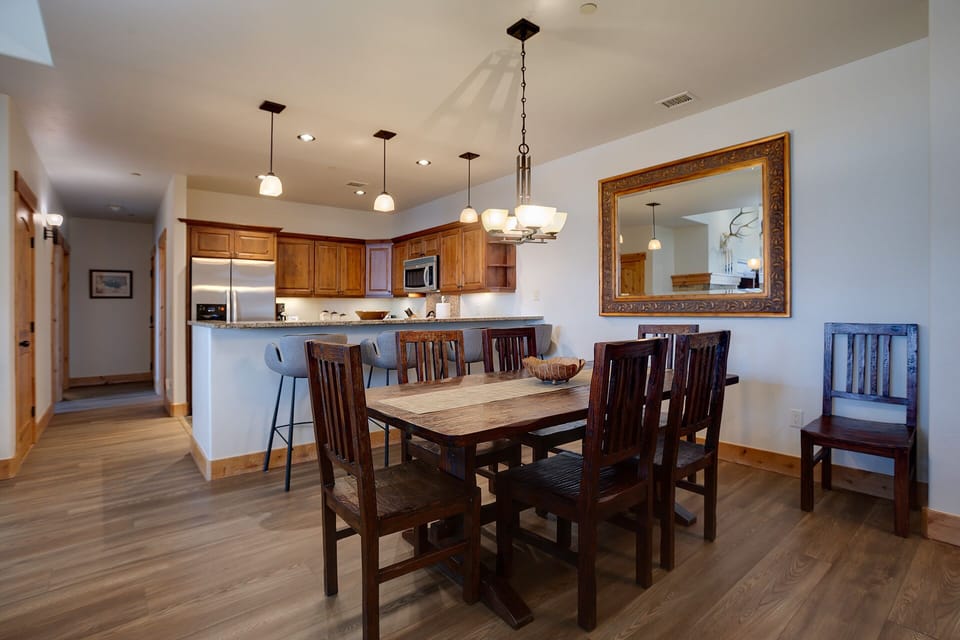 Gather around your spacious dining table for memorable meals with loved ones in this elegant open-concept space.