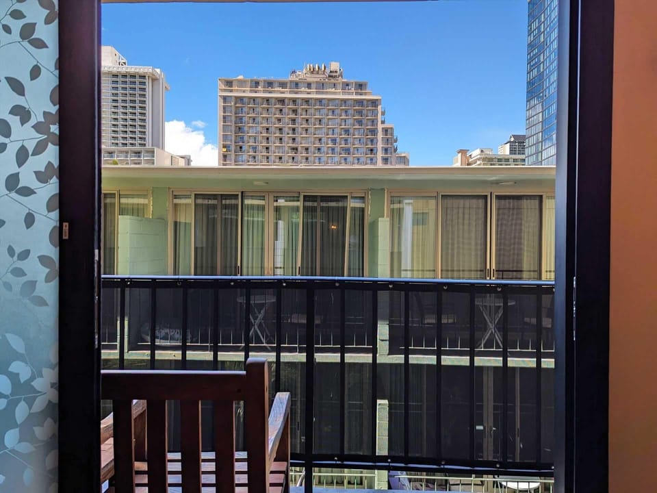 There is a skyline view from the lanai over the top of the small hotel next door.  For your convenience, we've installed a privacy film on the lower portion of the sliding glass door, so you do not need to keep the curtains closed.  (Hopefully, you'll be out exploring the island anyway!)