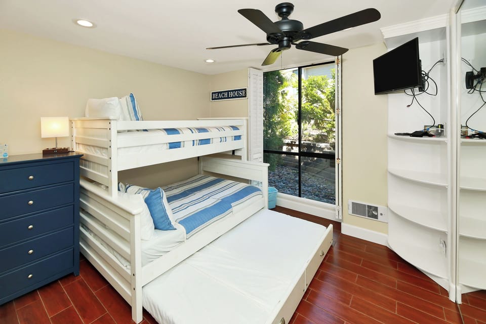 Twin over Queen bunk with a  twin trundle bed allows for a myriad of  sleeping arragments